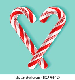 Bright poster with candy cane heart. Two red and white glossy realistic lollipops with shadow isolated on spearmint color background. Vector design for greeting card, tag, gift sticker