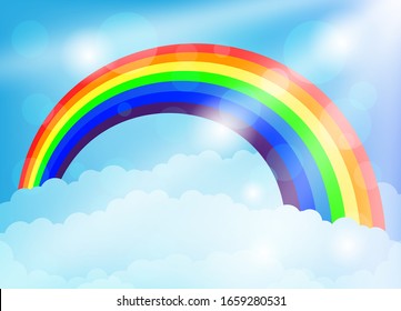 Bright rainbow and clouds in the blue sky.
