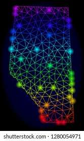 Bright rainbow mesh vector map of Alberta Province with glowing effect. Abstract lines, triangles, light spots forms map of Alberta Province on a dark background.
