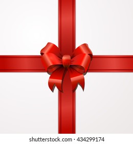 Bright red bow-knot with tape with shadow on white