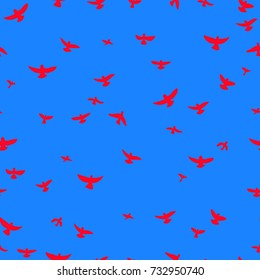 bright red flying birds on a blue background. Seamless pattern. Modern stylish texture.  Freehand drawing vector.
