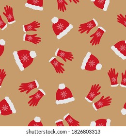 Bright red hats and gloves with white fur on beige background. Seamless doodle cozy  winter clothes pattern. Suitable for textile, wrapping, wallpaper.