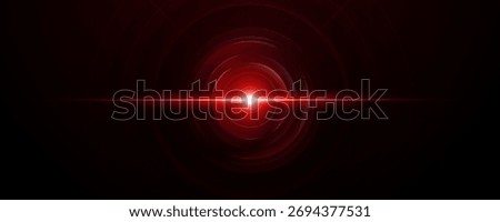 Bright red laser light core with concentric glow rings on black