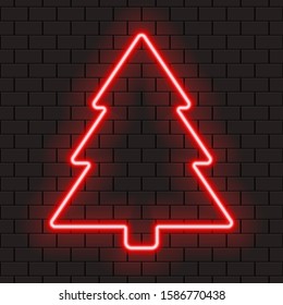 Bright red neon frame in shape of christmas tree for banner or sign isolated on a dark brick wall.