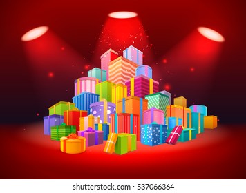 Bright scene with big mountain of presents in the light of spotlights on red background