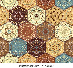 Bright seamless pattern of hexagonal tiles with vintage ornament. Colorful vector set of elements for design of wallpaper, fabric or wrapping paper.