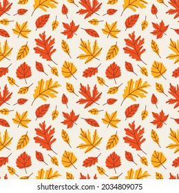 Bright seamless pattern of oak, Canadian maple, apple leaves for printing on fabric, clothing, wallpaper, gift paper and packaging. Autumn vector illustration with tree leaves on a gray background.
