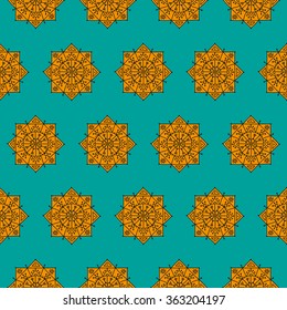 Bright seamless pattern with orange ethnic rosettes on a blue background. Vector illustration