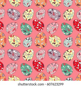 Bright seamless pattern with random placed multicolored Easter eggs. Paschal chicken eggs colored with hearts and placed on coral background. 
