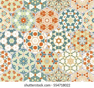 Bright seamless pattern tiles. Colorful vector set of hexagonal elements for design of wallpaper, fabric or wrapping paper.