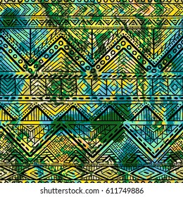 Bright seamless pattern. Watercolor texture. Ethnic and tribal motifs. Geometric ornament. Textile print. White, black, blue, green and yellow colors. Vector illustration.