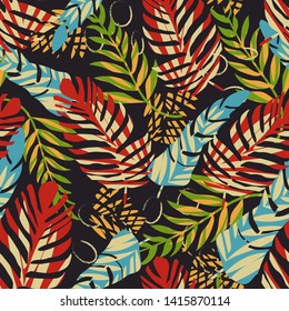 Bright seamless tropical pattern with leaves and flowers on a dark background. Vector design. Jungle print. Textiles and printing. Floral background.