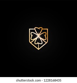 Bright shiny golden casino logo icon with  four leaf clover. Metal color logotype, label, emblem for gambling establishment, lottery, lucky place brand