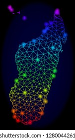 Bright spectrum mesh vector map of Madagascar Island with glare effect. Abstract lines, triangles, glare spots forms map of Madagascar Island on a dark background.