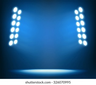 Bright spotlights on dark blue background