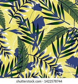 Bright summer seamless pattern with tropical leaves and flowers on a pastel background. Vector design. Jung print. Floral background. Printing and textiles.