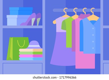 Bright summer women's clothes hanging in a wardrobe