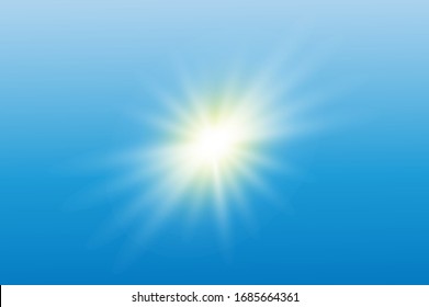 The bright sun on a blue sky sparkles with rays.