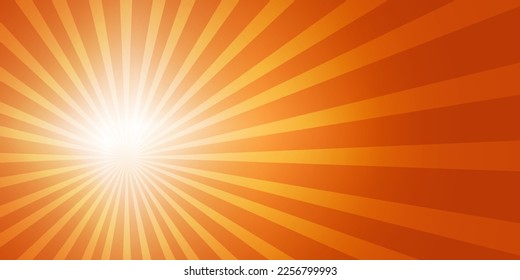 Bright sun on the left side of the sky with sun rays and lens flares in a bright orange sky. Copy space