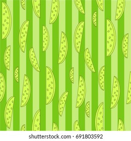 Bright sunny seamless pattern, green stripes on a yellow background with slices of fruit, lemon, stylized fruit, taste of freshness. Freehand drawing vector.