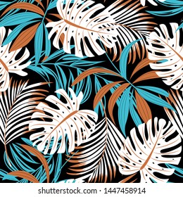 Bright trend seamless pattern with colorful tropical leaves and plants on black background. Vector design. Jungle print. Floral background. Printing and textiles. Exotic tropics. Fresh design.