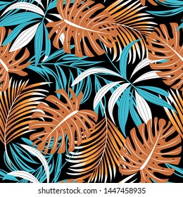 Bright trend seamless pattern with colorful tropical leaves and plants on black background. Vector design. Jungle print. Floral background. Printing and textiles. Exotic tropics. Fresh design.