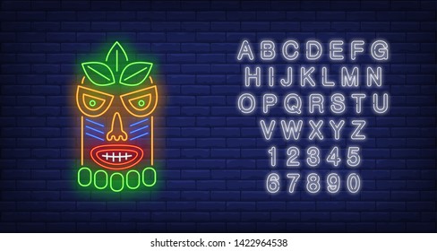 Bright tribal mask neon sign. Tiki idol, ancient culture design. Night bright neon sign, colorful billboard, light banner. Vector illustration in neon style.