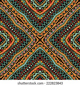 Bright tribal seamless ornament. Geometric ethnic pattern in bright colors. Abstract symmetric pattern. Tribal background ornament. Colorful texture. Vector file is EPS8.