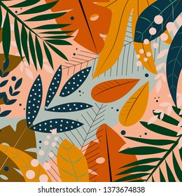 Bright tropical leaves on a delicate green background. Vector design.