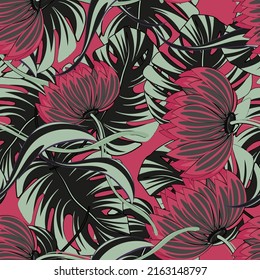 Flores y hojas de palma en un patrón tropical brillante sin costura. Antecedentes para la impresión en papel y material.