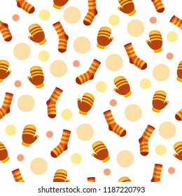 Bright vector seamless pattern with lots of socks, mittens and spots in autumn colors. Cute warm clothes. Cartoon fall background 
