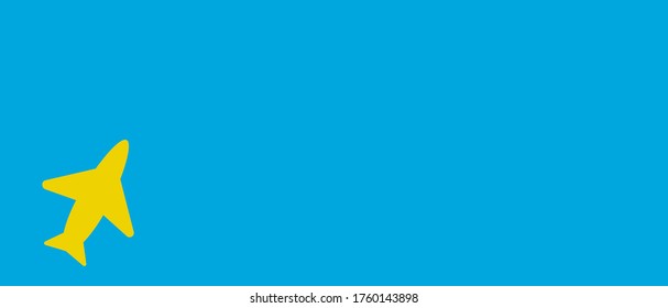 Bright yellow airplane on bright blue flat lay panorama for travel, holiday concepts or reopening after Coronavirus (COVID-19) global pandemic.
