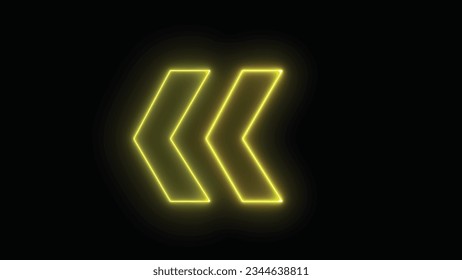 Bright yellow arrow for evacuation direction illuminated indoors. neon left direction in the night. Flashing direction indicators.