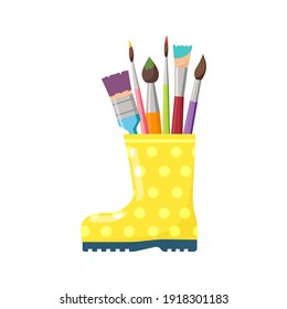 Bright yellow boot with colored artist brushes, isolated on white background. Bright spring composition. Cartoon style design element for Easter, artist workplace interior, home. Vector illustration