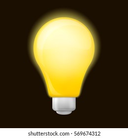 Bright yellow light bulb isolated on a black background