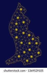 Bright yellow mesh Liechtenstein map with glow effect. Wire frame polygonal mesh in vector EPS10 format on a dark black background. Abstract 2d mesh designed with polygonal grid, points,