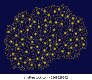 Bright yellow mesh Macedonia map with lightspot effect. Wire carcass polygonal mesh in vector EPS10 format on a dark black background. Abstract 2d mesh designed with polygonal grid, points,