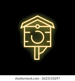 Bright yellow neon birdhouse glowing on a black background