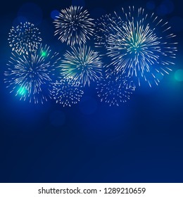 brightly colorful fireworks with pale smoke from fire on twilight background
