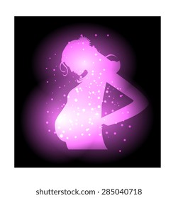 Brightly lit image of a pregnant woman on a black background