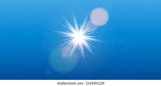 
The brightly shining sun shines with glare, shimmering with rays in the blue sky. Radiating the light of stars through the sun.