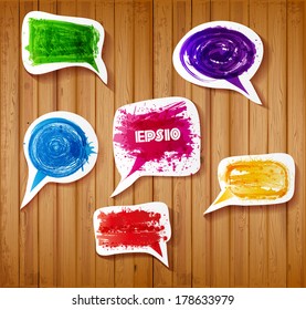 Brignt paper-cut speech and thought bubbles on realistic wooden background. Vector illustration.