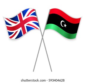 British and Libyan crossed flags. United Kingdom combined with Libya isolated on white. Language learning, international business or travel concept.