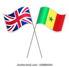 British and Senegalese crossed flags. United Kingdom combined with Senegal isolated on white. Language learning, international business or travel concept.