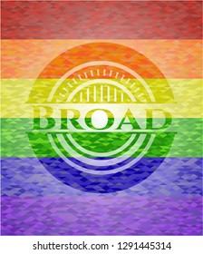 Broad on mosaic background with the colors of the LGBT flag