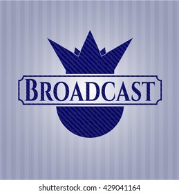 Emblema de difusión con fondo denim de alta calidad