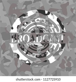 Broadcast on grey camouflaged texture