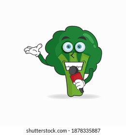Das Maskottchen Broccoli wird zum Gastgeber. Vektorgrafik