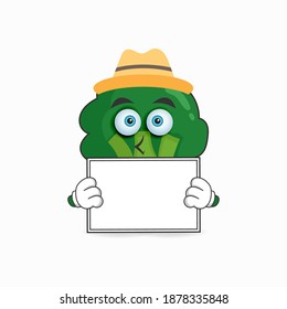 Broccoli mascot character holding a white blackboard. vector illustration