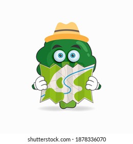 The Broccoli mascot character holds a map. vector illustration